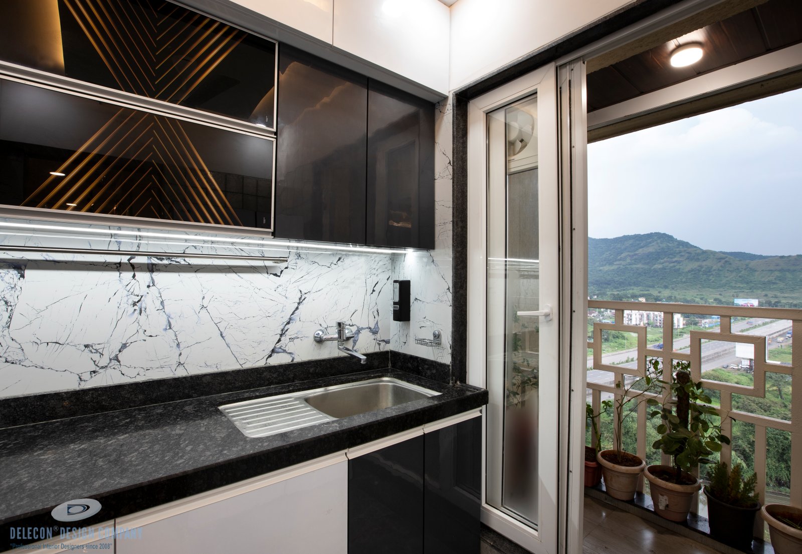 Modular kitchen storage and working counter in 2BHK flat at Sai World City Panvel